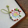 Handmade ceramic bracelet with bone and star beads on a green woven cord - Green Apple (1653-02)