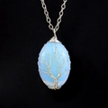 Detail of silver wire-wrapped tree of life pendant with opalite gemstone on black background - Silver + Opal