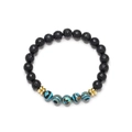 Lava stone bead bracelet with blue malachite accents and golden spacers on white background - Blue