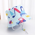 Detail of baby sun hat featuring blue excavator print and adjustable white wind rope - Light Blue Colorful Excavator
