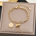 18k gold plated stainless steel bracelet with gourd charm and tassel on jewelry box - Gold Gourd Disc Multi-Element Style (5195)