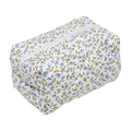 Quilted floral makeup bag with blue flowers and a secure white zipper closure - Blue Floral