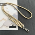 Close-up of adjustable 8mm khaki braided phone lanyard with silver metal hardware - 8mm Dual Adjustable / Camel