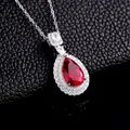 Elegant pear-cut red ruby pendant necklace with double-layer diamond halo on silver chain - Thick Silver White Gold - Lab Ruby Pear Shape