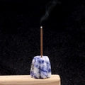 Blue and white marble texture flower incense holder on a wooden base with burning stick - Sodalite