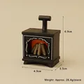 Miniature black dollhouse fireplace with orange glow and dimensions 6.9cm by 4.9cm - 1pc Fireplace