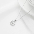 Silver stainless steel wave necklace with white shell inlay on white silk background - Sea Wave / Silver