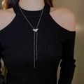 Close-up of a silver tassel necklace with a sparkling zircon-encrusted triangle pendant - Silver Rhinestone Inverted Triangle Style (27#)