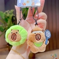 Cute Capybara plush keychain featuring tennis ball style and racket accessories - Tennis Duo