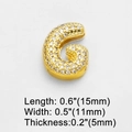 Detailed view of gold-plated letter G charm with cubic zirconia and 15mm length dimension - Letter G