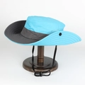 Detail of outdoor sun hat with breathable mesh and adjustable chin strap on wood stand - Adjustable / Sky Blue