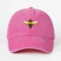 Detailed view of bee embroidery on a pink washed cotton baseball cap with vintage texture - One Size / Rose Red