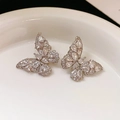 Elegant silver butterfly earrings encrusted with sparkling crystals in a white ceramic dish - Full Pave Butterfly / Silver