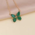 Detail of green butterfly pendant with gold plating on soft beige satin fabric - 6# Peacock Green Necklace