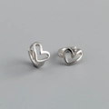 Detailed close-up of heart-shaped silver earrings with elegant metallic finish on grey background - Heart-shaped Hoop Earrings (S-E1561) / Silver
