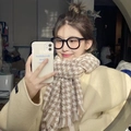 Chic houndstooth pattern winter scarf paired with a beige coat for a stylish cozy look - Houndstooth Khaki