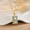 Macro detail of gold tarot sun pendant featuring Le Soleil engraving and blue zircon inlay - Gold Sun Sky Blue Enamel Style (XL0516)