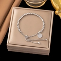 Detail of silver beaded bracelet featuring a round polished charm and adjustable slide clasp - Slider Bead Silver