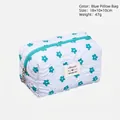 Blue floral quilted makeup bag with zipper, sized 18x10x10cm for cosmetics storage - Blue Pillow Pouch