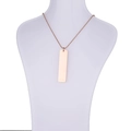 Detailed view of a rose gold rectangle pendant necklace on a white mannequin bust - Rose Gold