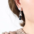 Elegant drop earrings featuring a white pearl top and a sleek black teardrop glass stone - Steel Color (F820)