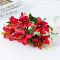 Artificial red lily bouquet with green leaves and white accents in professional studio shot - Bright Red