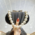 Elegant black evening clutch with vertical pleats and oversized pearl beaded handle - Black