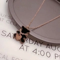 Rose gold necklace with a black bear pendant and a Love heart charm on a tray - Black Shell Bear Rose Gold Necklace