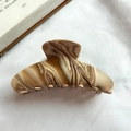 Brown and beige marbled acetate hair claw clip for thick hair on a white fabric background - Brown Marble Acetate