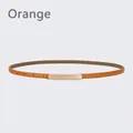 Slim orange leather belt for women featuring a polished gold rectangular metal buckle - 105cm / Orange