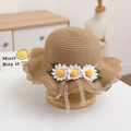 Close-up of khaki woven straw hat featuring delicate white daisies and pink mesh ribbon - Single Hat / Khaki