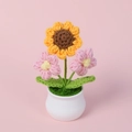 Handmade crochet sunflower and pink flowers in white ceramic pot on pink background - Yellow Pink (Pink Puff Flowers)