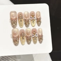 Handmade press-on nails with champagne gold cat-eye effect and 3D lion dance charms - Extra Small (XS) / Golden Glaze Long Oval (3475)