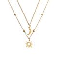 Detail of double-layer gold necklace featuring sun and moon pendants with golden beads - Double Layer Sun Moon / Gold