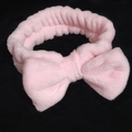 Soft pink plush headband with bow tie design for face washing and skincare routines - Plush Bow Hairband / Pink