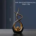 Modern abstract 8-shaped ceramic sculpture in black and gold finish, height 25cm - Morning Song Tall Style Black Gold - Small