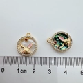 Detail of 18K gold-plated rabbit pendants with shell inlay and cubic zirconia bezel - Rabbit (Abalone Shell) / Gold