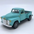 Vintage alloy pickup truck model in turquoise with chrome details and classic retro styling - Teal Blue