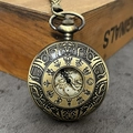 Vintage bronze hollow mechanical pocket watch with gear pattern and intricate relief - Bronze