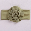 Elastic baby headband featuring a large green fabric flower with a lustrous finish - Green