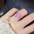 Pink square gemstone ring in rose gold with halo diamonds worn on a finger - Ring Size 6 / Pink