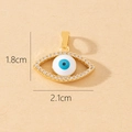 Detail view of a gold evil eye pendant with tiny zircons measuring 1.8cm by 2.1cm - Gold Eye Shape Inlaid Transparent Zircon Pendant (F)