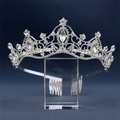 Macro detail of silver bridal tiara with sparkling marquise rhinestones on blue background - Silver / White Zirconia