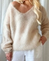 Detail view of the soft v-neck mohair knit sweater with fluffy knit texture in cream white - S / Apricot