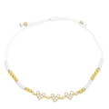 Close-up of handmade white braided bracelet with three cubic zirconia heart charms - White