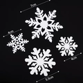 White snowflake holiday decorations in 4cm, 5.5cm, and 7cm sizes on black background - 4pcs Silver Acrylic Snowflakes without Sticks