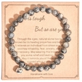 Pink zebra stone bead bracelet with a silver heart charm on brown paper gift card - Gray Veined Stone Heart With Card Style