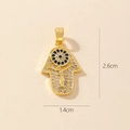 Detail view of gold Hamsa pendant with blue rhinestones and dimensions 1.4cm by 2.6cm - 0371-7/Micro Pave Figure Hamsa