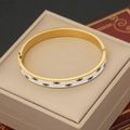 Detail of golden evil eye bangle with white enamel inlay and hinge closure mechanism - White Eye Pattern (5#)