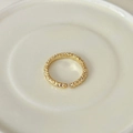 Adjustable golden open ring with unique lava rock texture on white ceramic tray - Adjustable Open / Gold Lava Texture Style (J3270)
